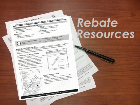 A Rebate Resources graphic with Rebate forms sitting on a table with a pen next to them.